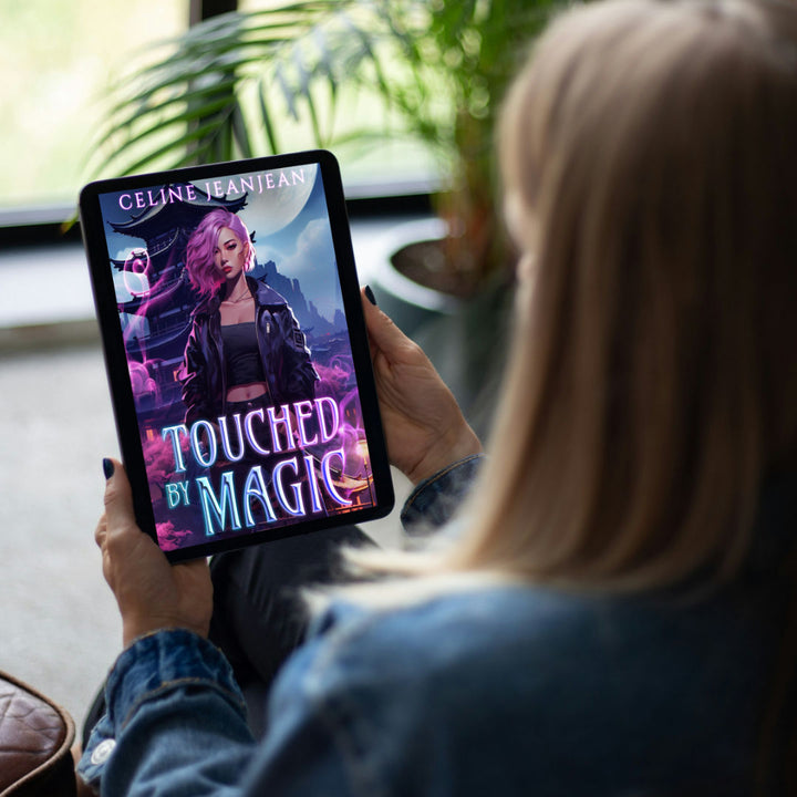 Over-the-shoulder view of a woman reading 'Touched by Magic' by Celine Jeanjean, an Asian Urban Fantasy novel displayed on a tablet, with a vivid cover illustration featuring a mystical female character in a fantastical city setting
